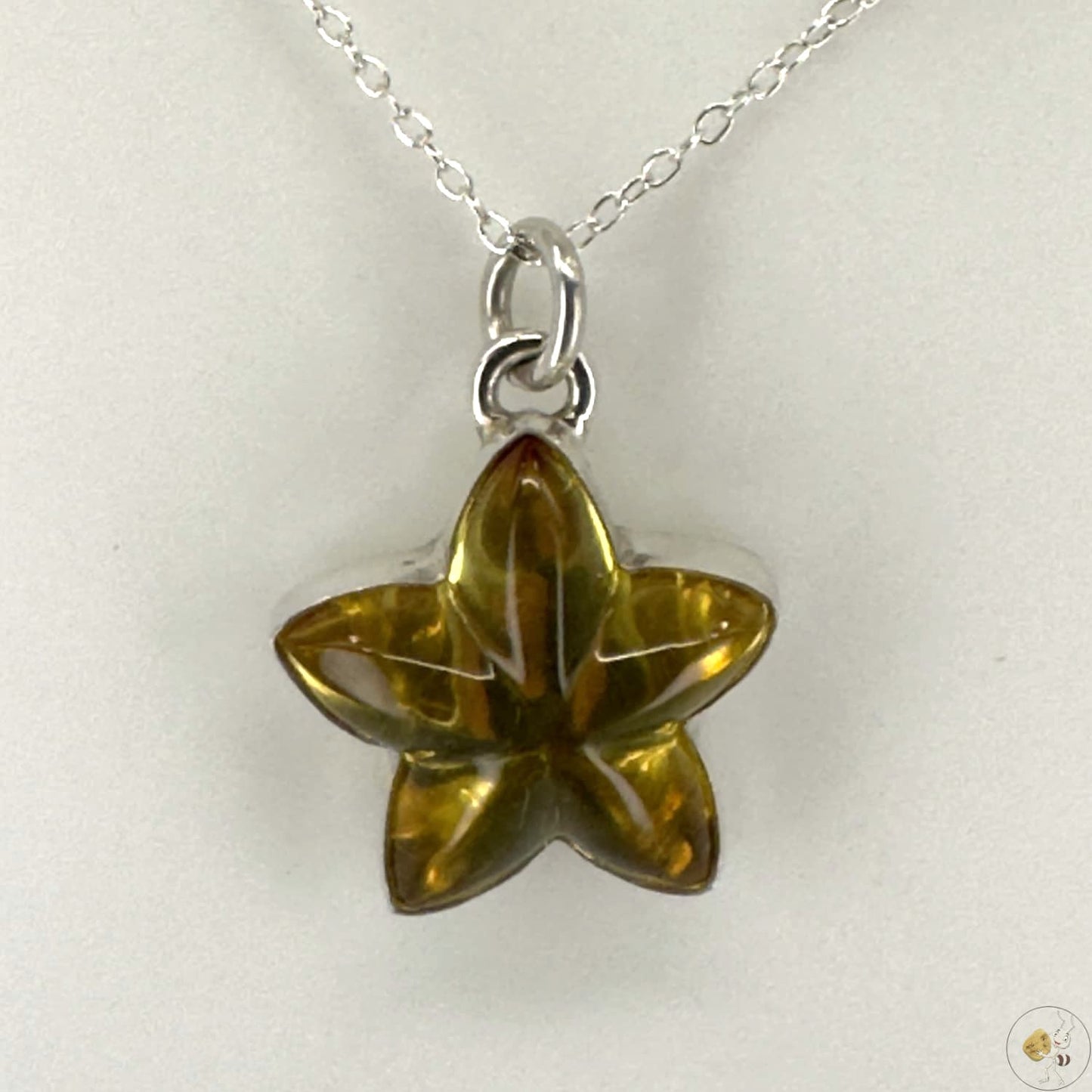 Pendentif étoile en ambre naturel monté sur argent 925/950-02