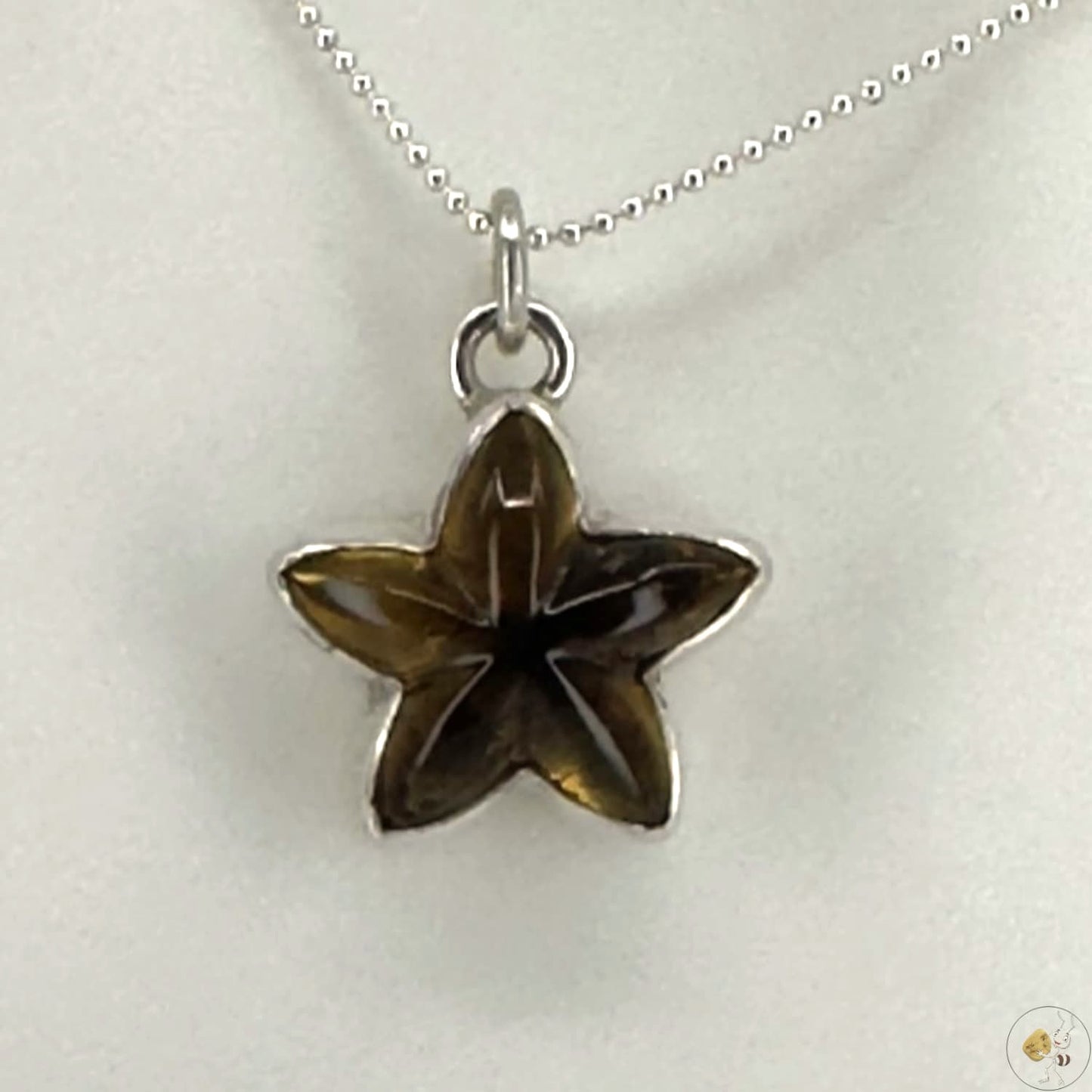 Pendentif étoile en ambre naturel monté sur argent 925/950-02