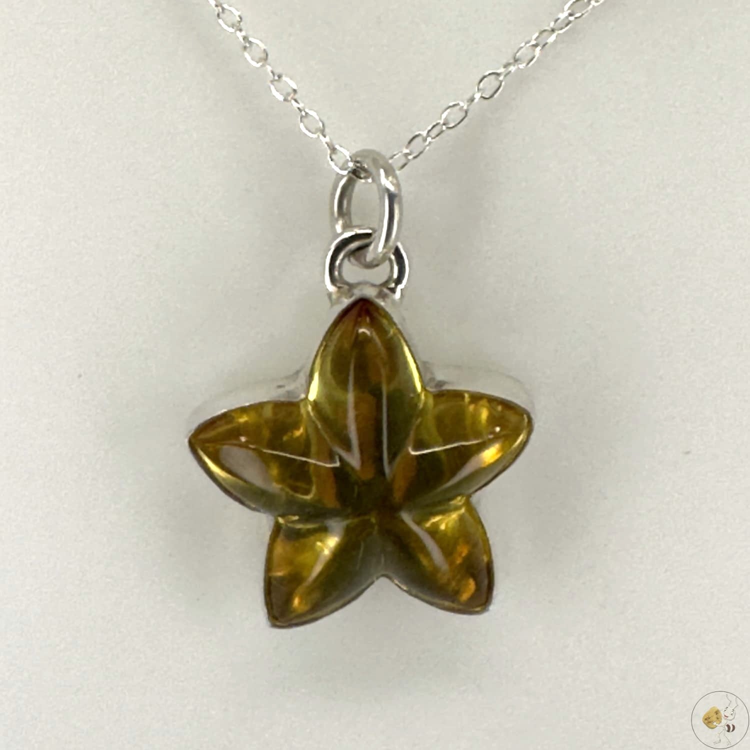 Pendentif étoile en ambre naturel monté sur argent 925/950-02