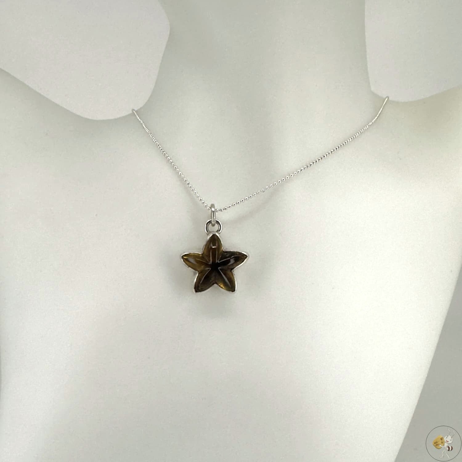 Pendentif étoile en ambre naturel monté sur argent 925/950-01