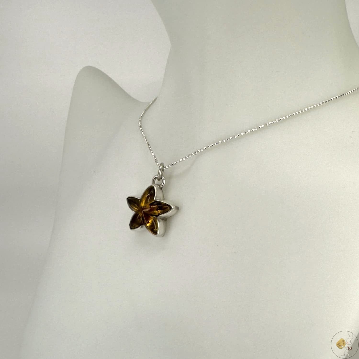 Pendentif étoile en ambre naturel monté sur argent 925/950-03
