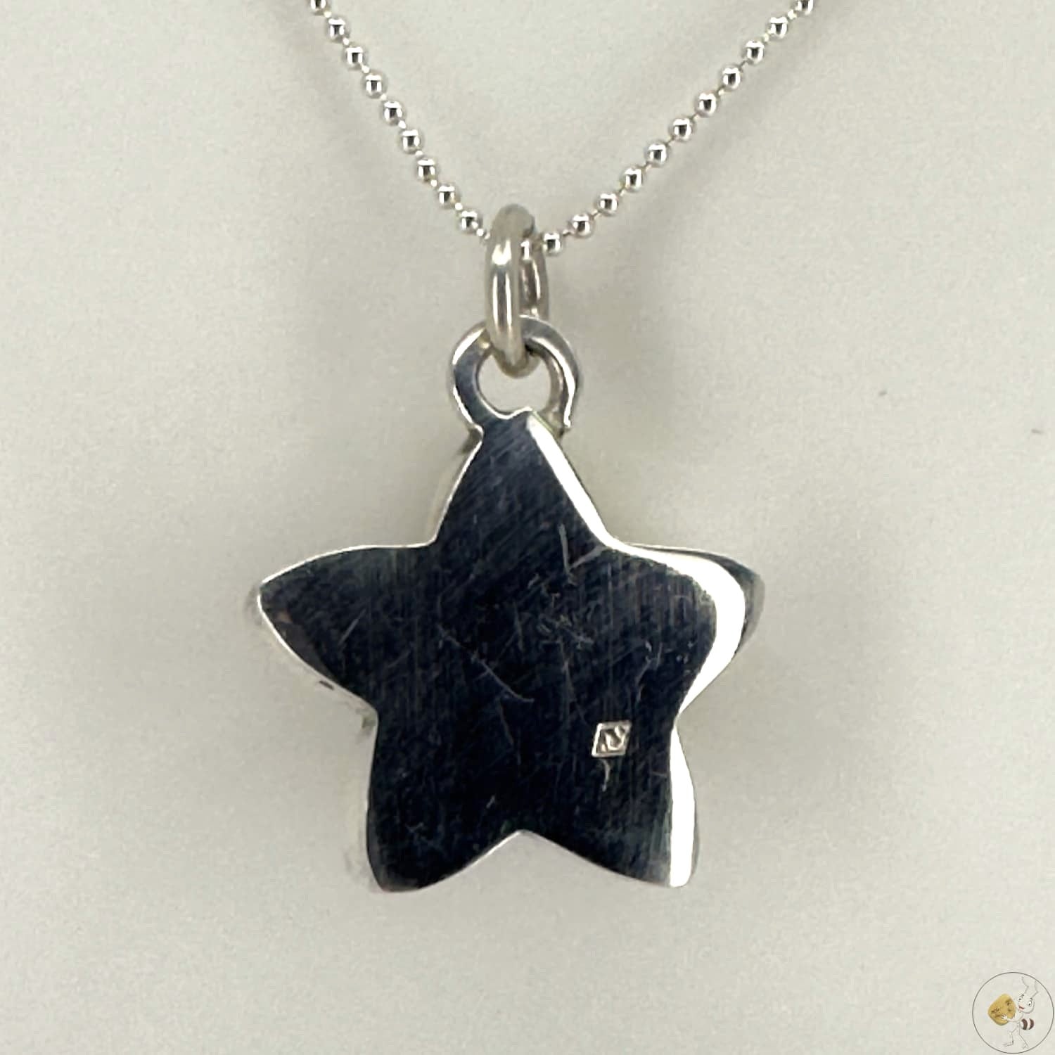 Pendentif étoile en ambre naturel monté sur argent 925/950-04